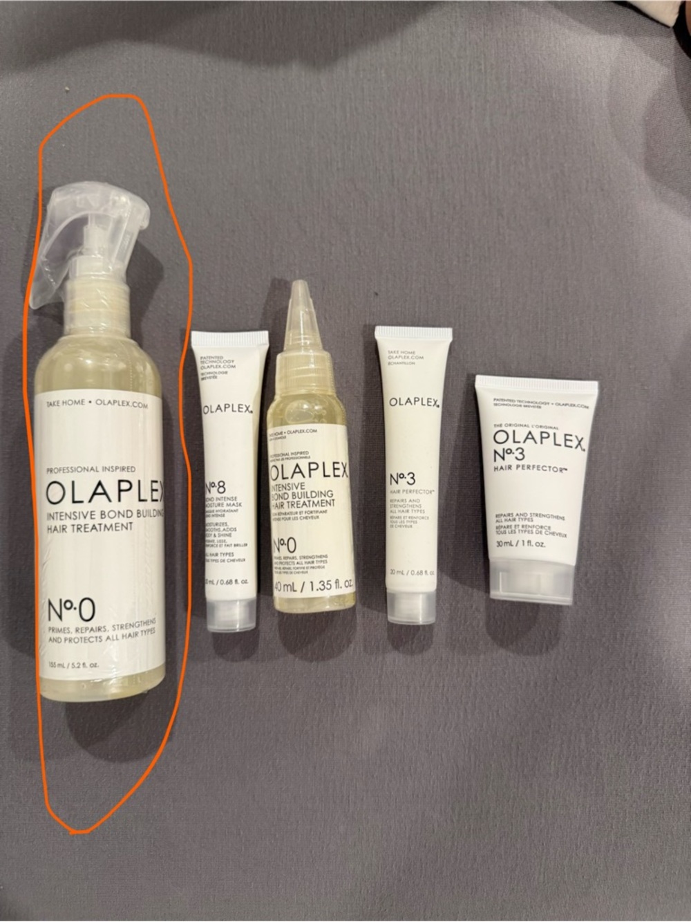 OLAPLEX No.0 Intensive Bond Builder - bottles circled in orange